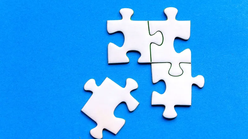 White puzzle pieces on a blue background